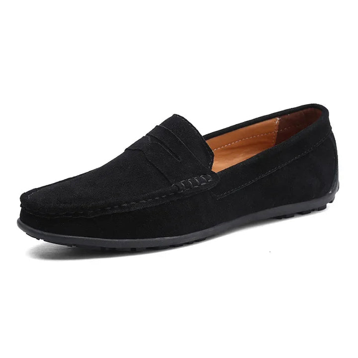 Side profile of black men's penny loafers with stitched detailing