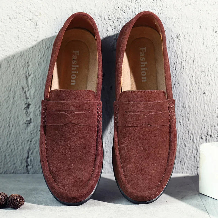 Angled shot of men's casual slip-on shoes displaying the flexible upper material and classic low-profile design for versatile