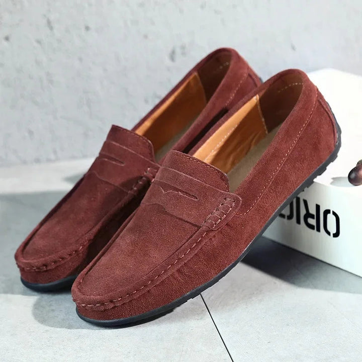Rear view of men's casual footwear loafers, emphasizing the supportive heel counter and clean stitching details for everyday