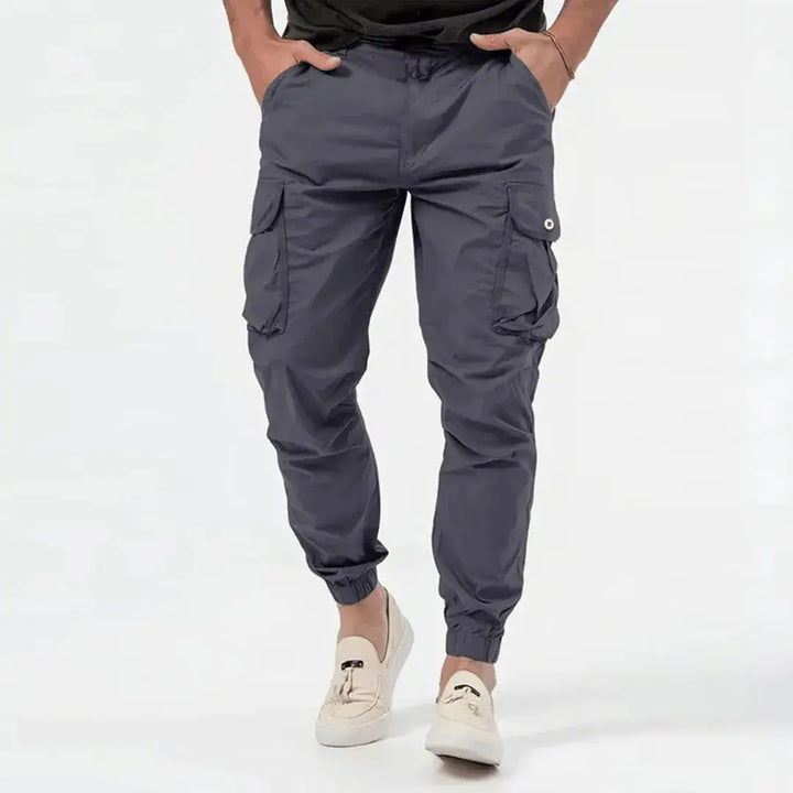 Mens cargo joggers featuring deep side utility pockets and tapered fit