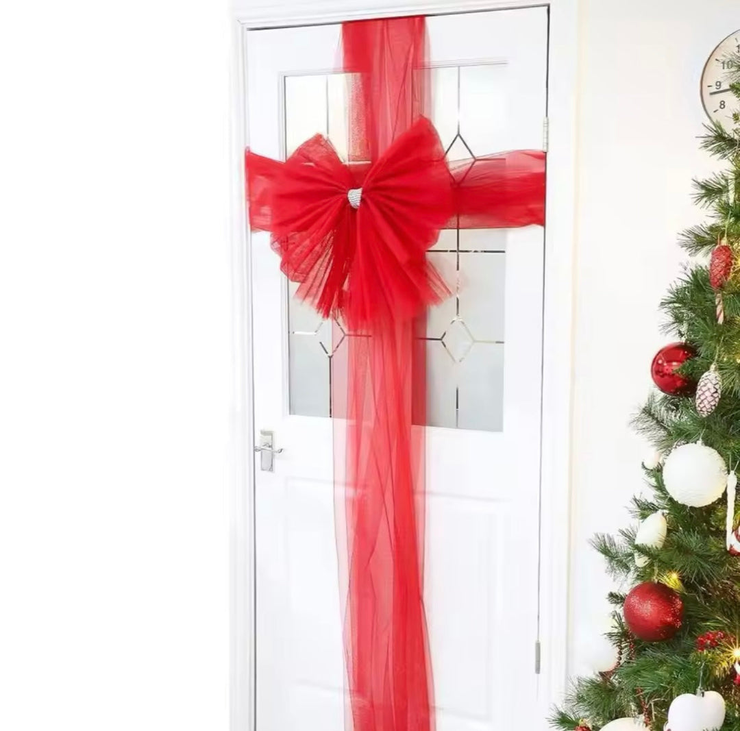 Oversized festive red door bow for Christmas holiday decoration and front door accent