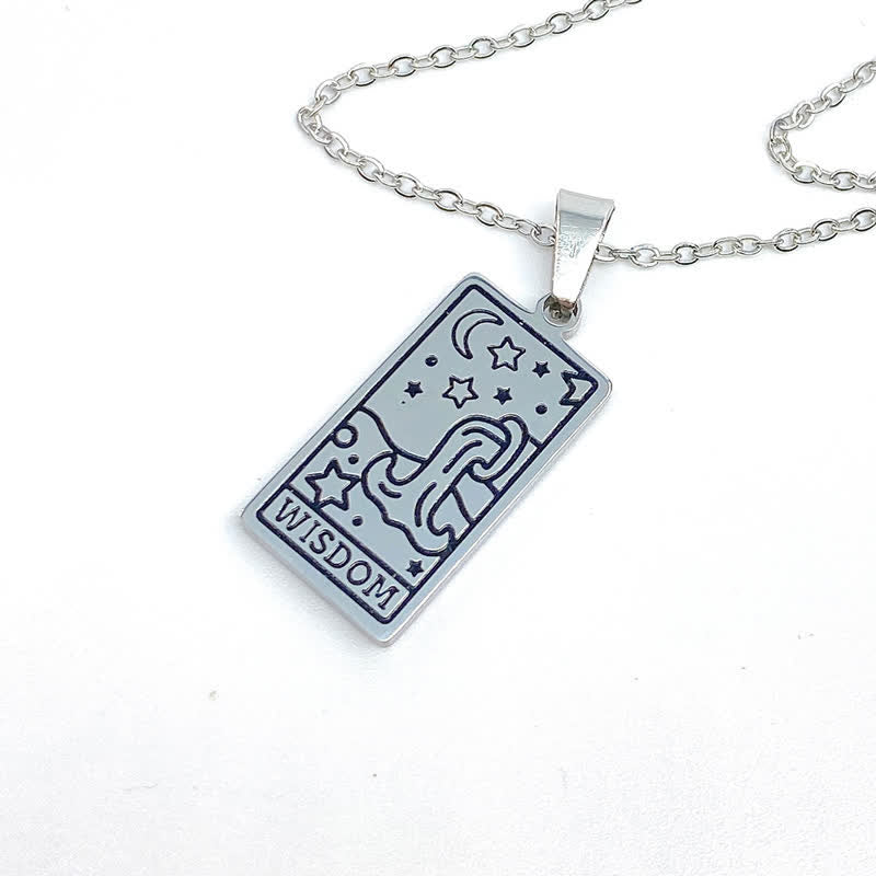 Gold vintage tarot necklace displaying intricate card engraving