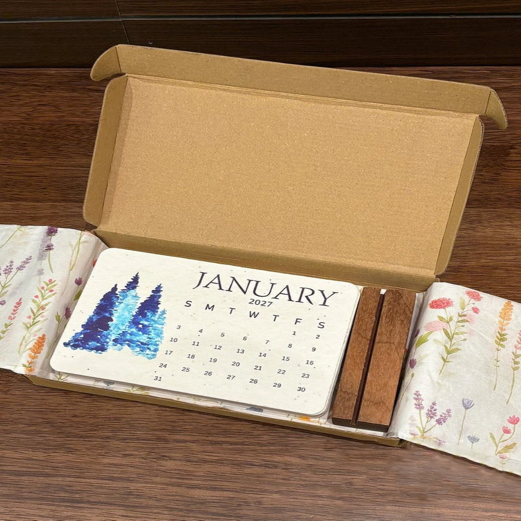 Eco friendly 2027 seed paper calendar hanging on a wall showing monthly layout