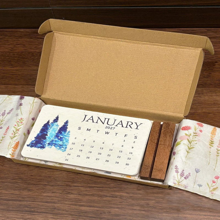 Eco friendly 2027 seed paper calendar hanging on a wall showing monthly layout