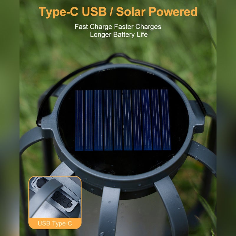 Solar LED flame effect lantern glowing softly on a dark patio table