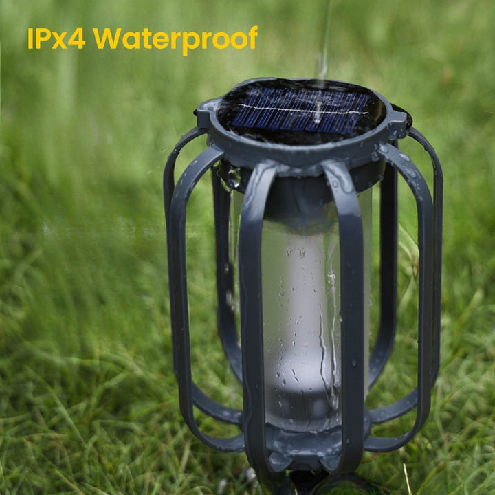 Hanging outdoor solar lantern lighting up a patio deck at night