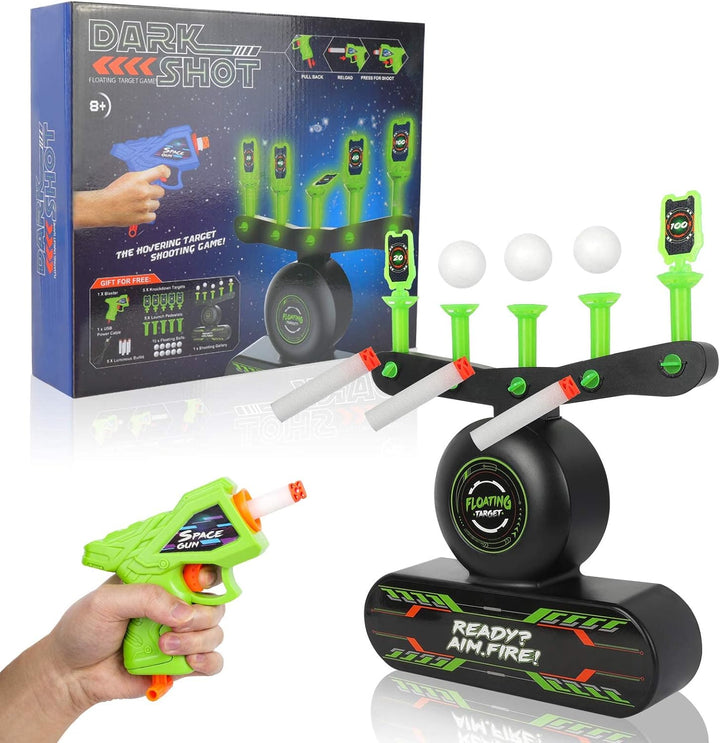 Hand holding a toy blaster aiming at glowing floating balls on a target base
