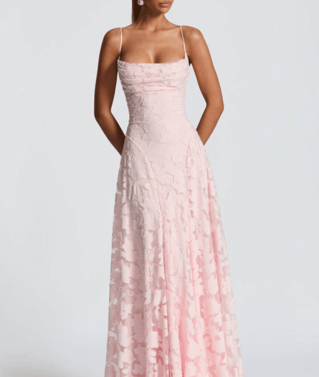 Close-up of the intricate lace-up back detail on a floral party dress