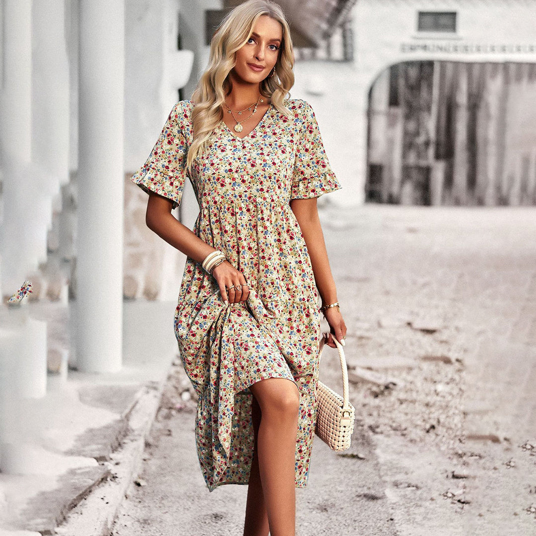 Blonde woman wearing apricot floral print midi dress outdoors