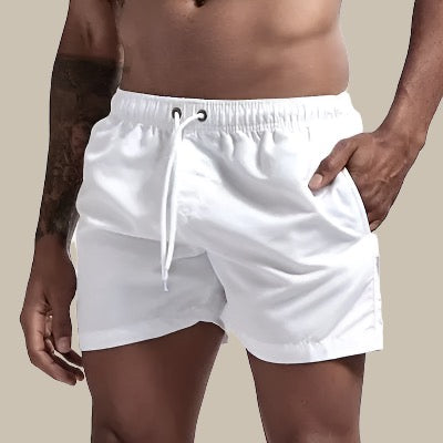 Man wearing clean white men's swim shorts for beach and pool days