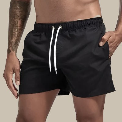 Mens drawstring swim shorts in regular fit, ideal for beachwear and summer pool days.