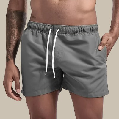Side profile of stylish mens swimwear shorts, perfect for pool and vacation wear.