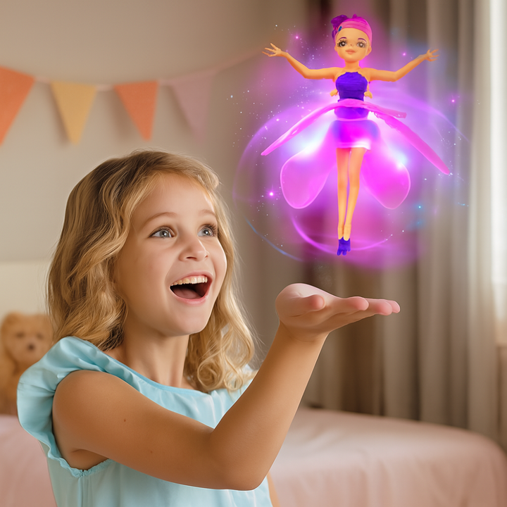 Excited young girl playing with a glowing LED flying fairy toy indoors