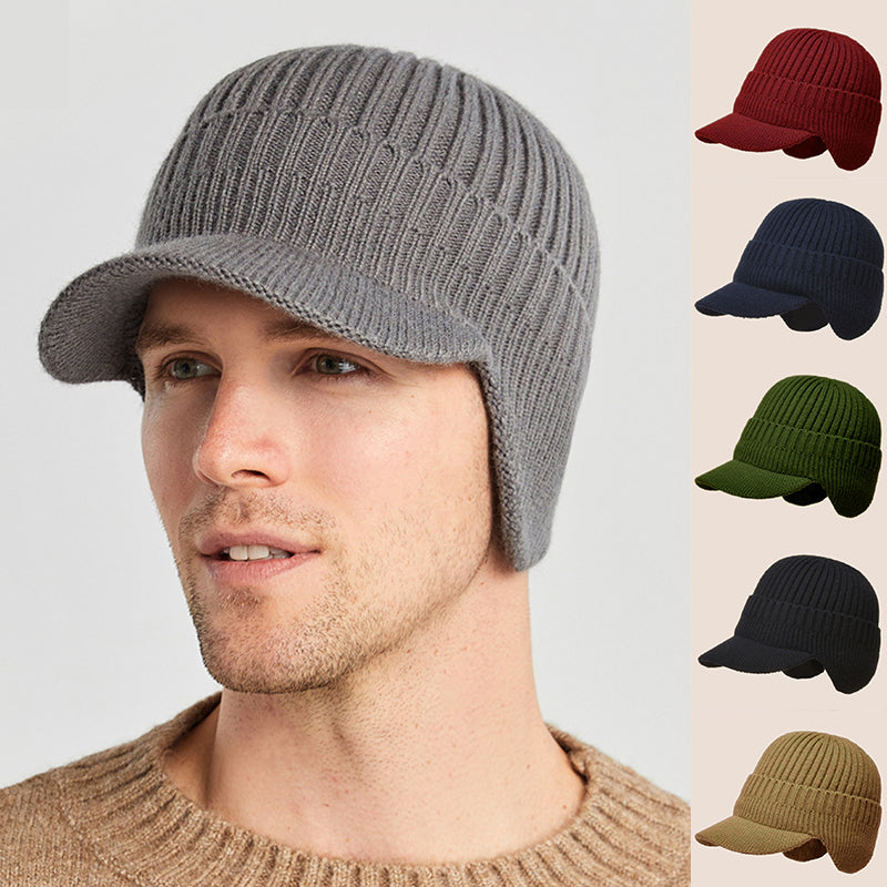 Man wearing gray winter beanie with ear protection