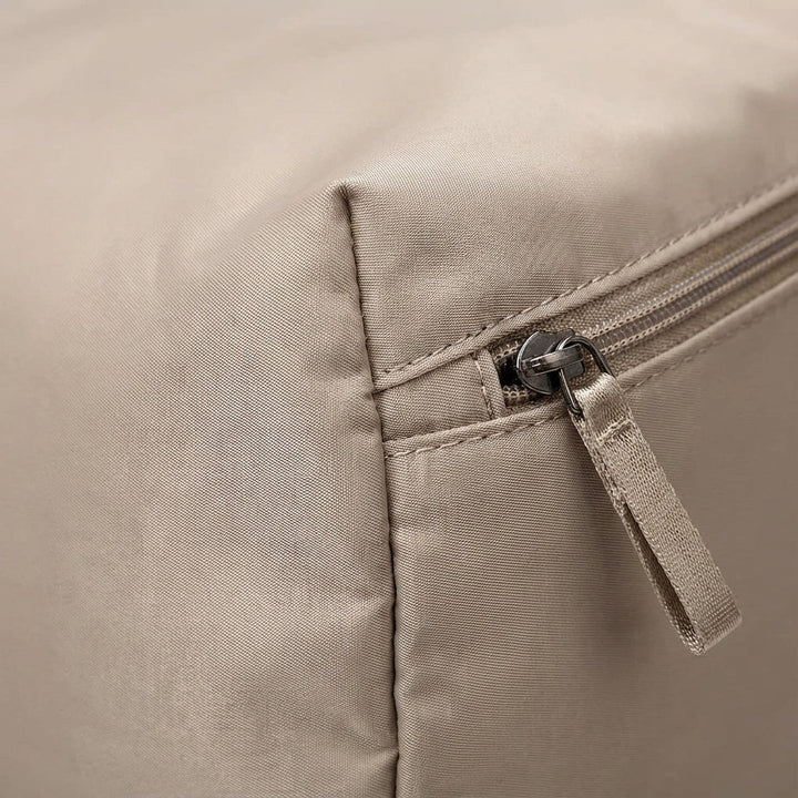 Unisex expandable travel bag showing wet-dry separation compartment for gym gear
