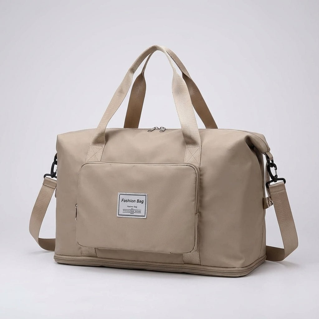 Beige foldable travel bag shown in studio lighting against a neutral background