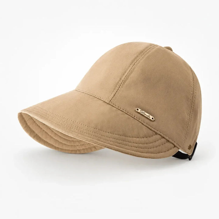 Women's camel foldable wide-brim sun hat viewed from the side against a white background