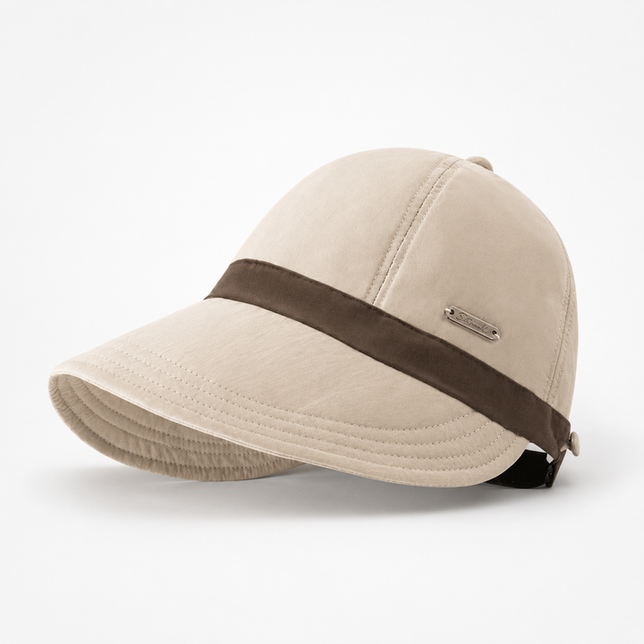 Cream foldable sun hat with a brown accent line and metal branding detail