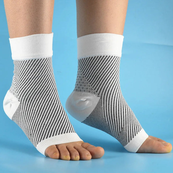 Side view of foot wearing plantar fasciitis compression sleeve
