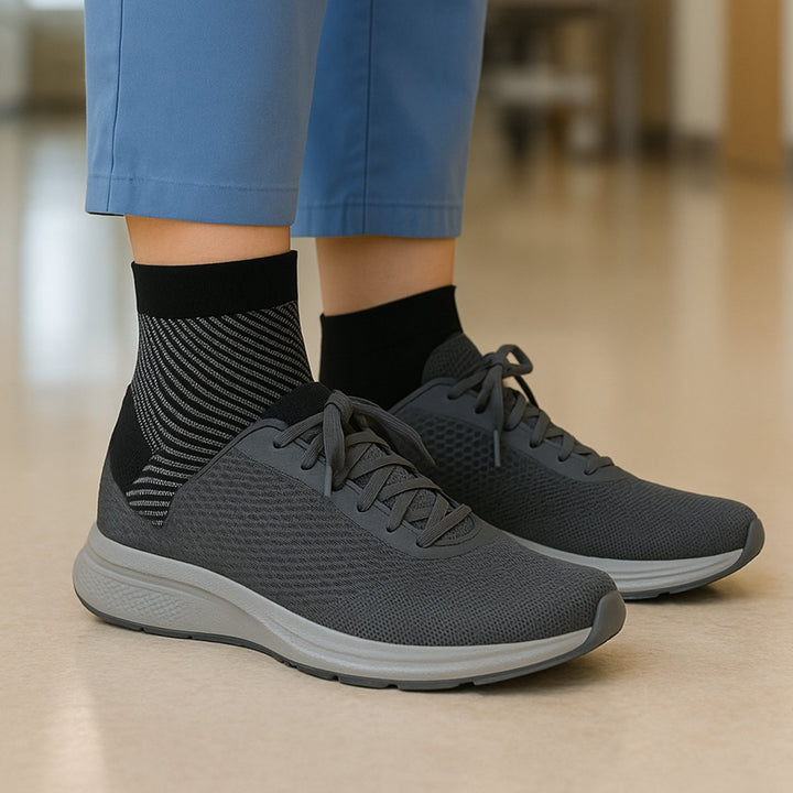 Ankle support sleeve with arch support in neutral skin tone