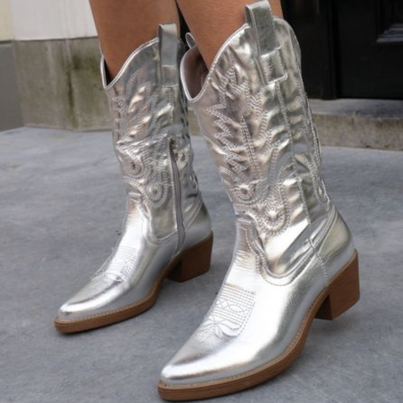 Silver metallic cowboy boots styled outdoors on city streets