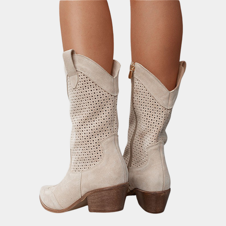 Close up of perforated pattern on womens western ankle boots