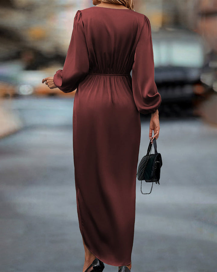 Back view of model in a long sleeve wrap midi dress