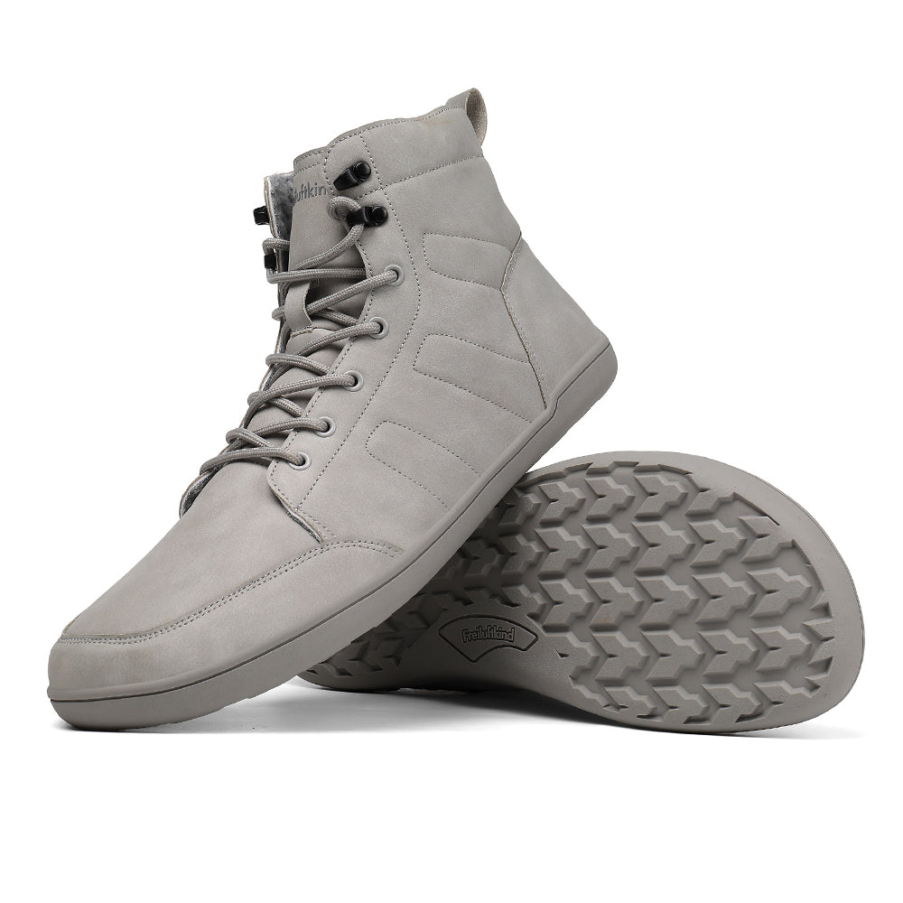 Grey water-resistant barefoot winter boot displayed with textured outsole