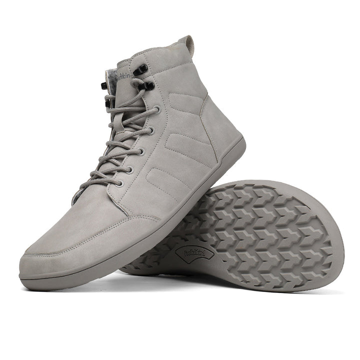 Grey water-resistant barefoot winter boot displayed with textured outsole