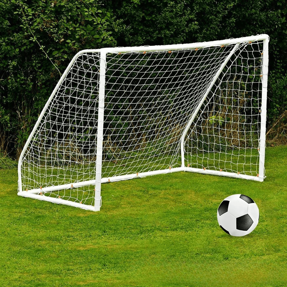 Full-size white soccer goal net set up on a grass field with a football