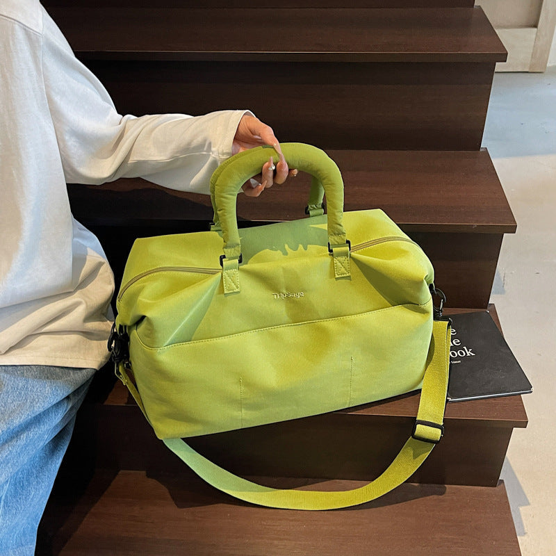 Unisex luggage sports bag worn over the shoulder highlighting adjustable comfort strap