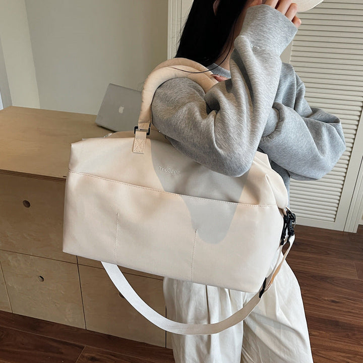 Commuter bag featuring reinforced handles and sturdy hardware details