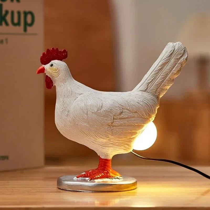 Full side profile of the quirky white chicken table lamp