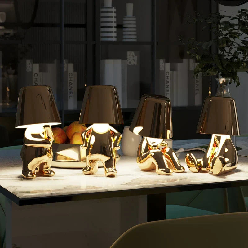 Close-up view of the touch control sensor on the sleek artistic table lamp