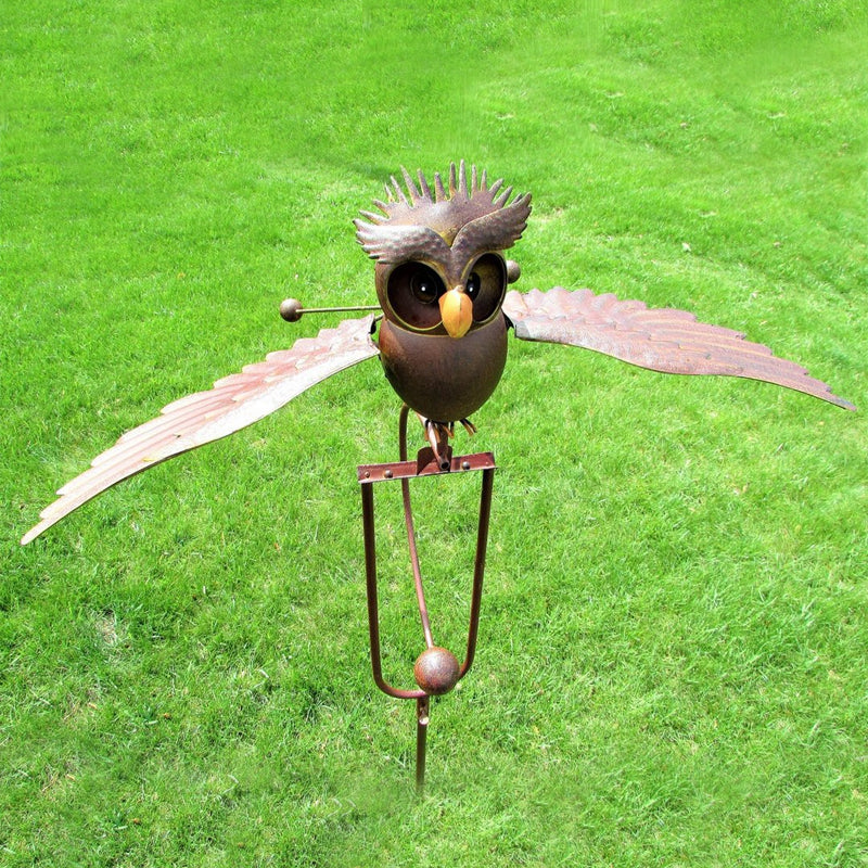Kinetic metal bird garden sculpture spinning in the wind