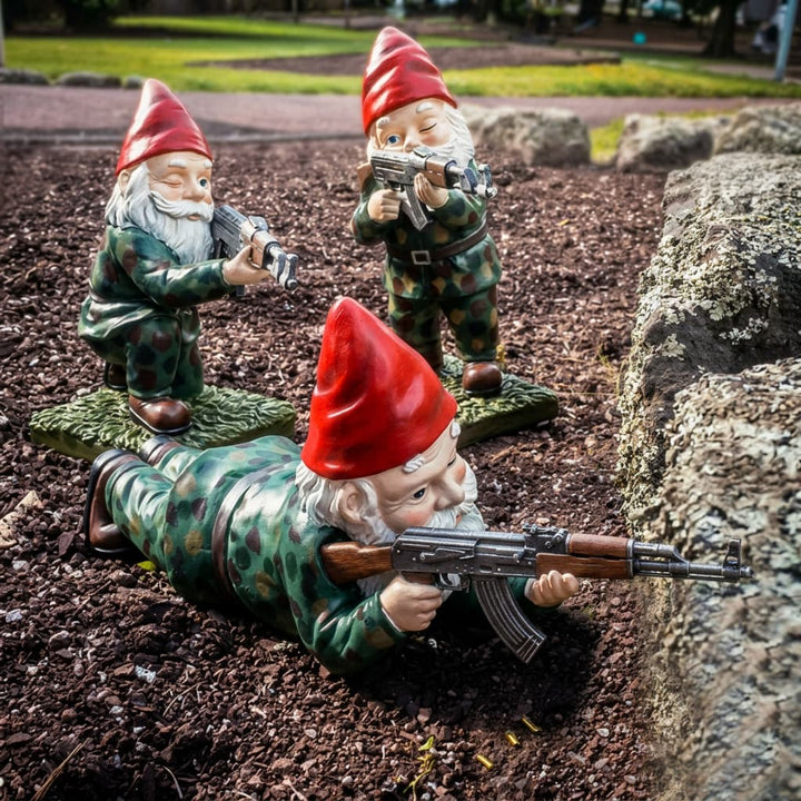 Tactical garden gnome warrior statue holding a rifle for funny outdoor decor