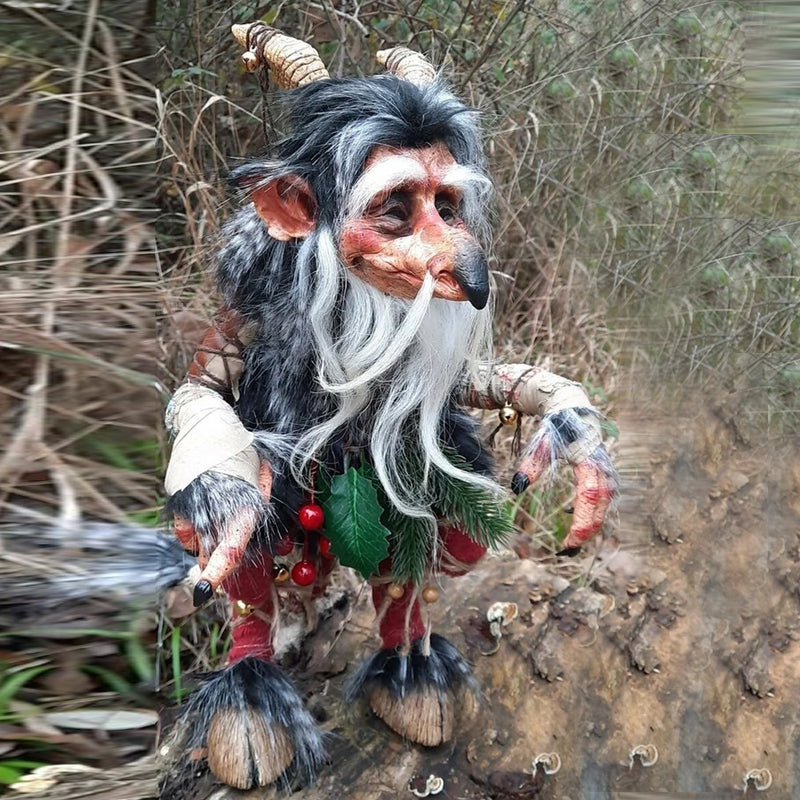 Large fantasy decor goblin figure standing in a green outdoor garden