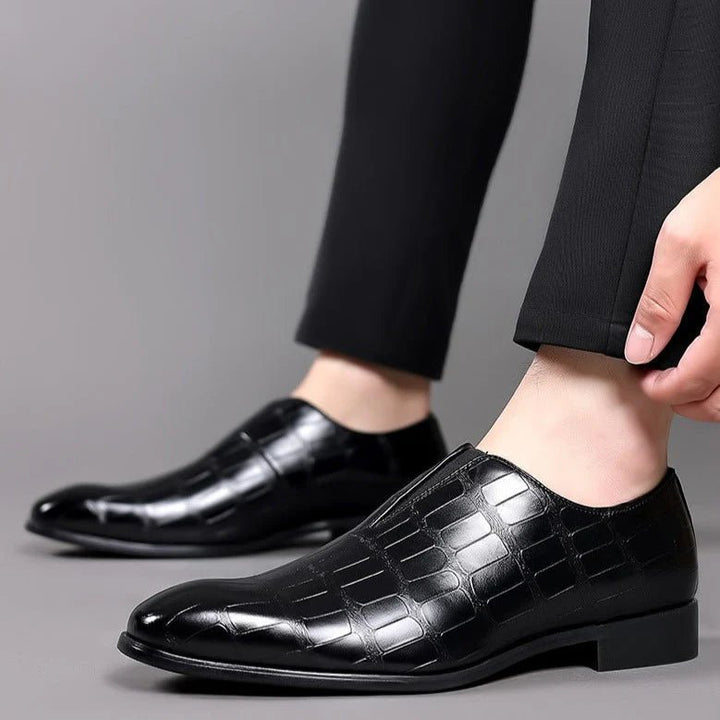 Close up of men's blue dress loafers highlighting the comfortable cushioned insole.