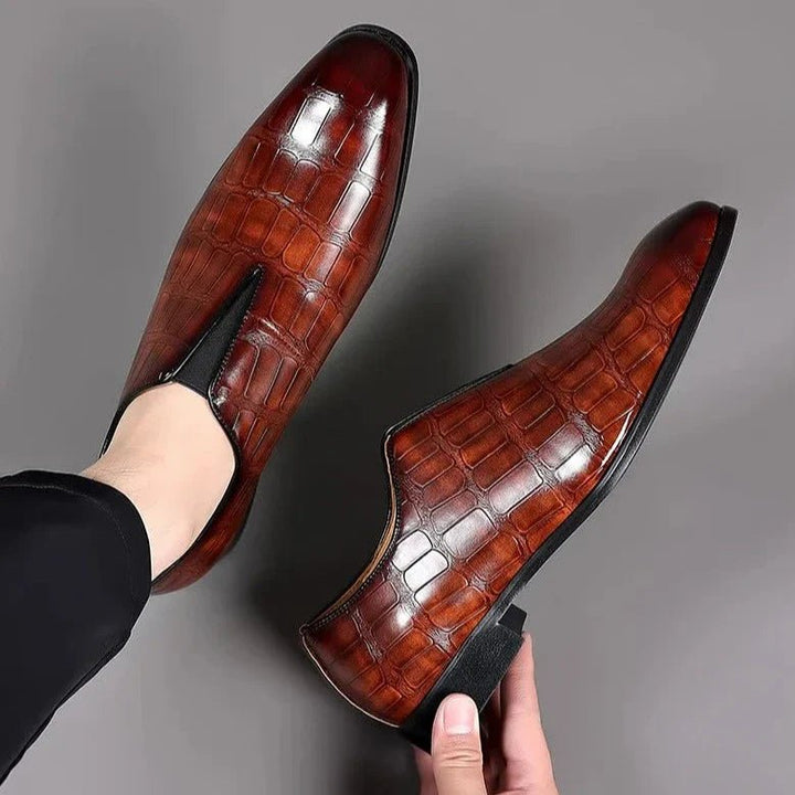 Top and side view of brown men's dress loafers