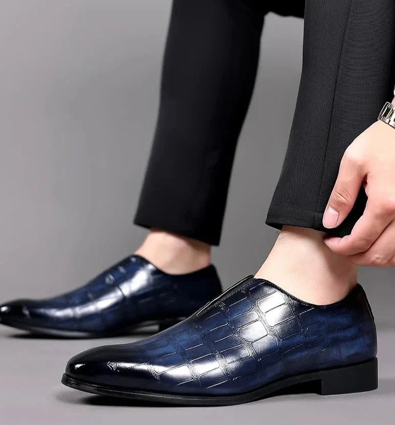 Bottom sole view of men's comfortable loafers displaying anti-slip traction pattern.