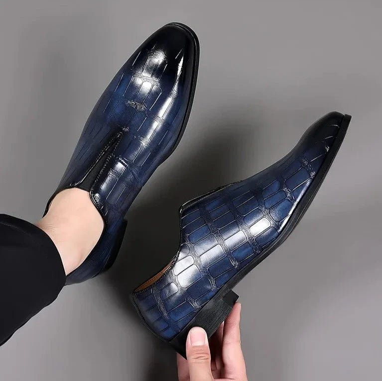 Pair of stylish men's dress loafers arranged neatly for formal wear occasions.
