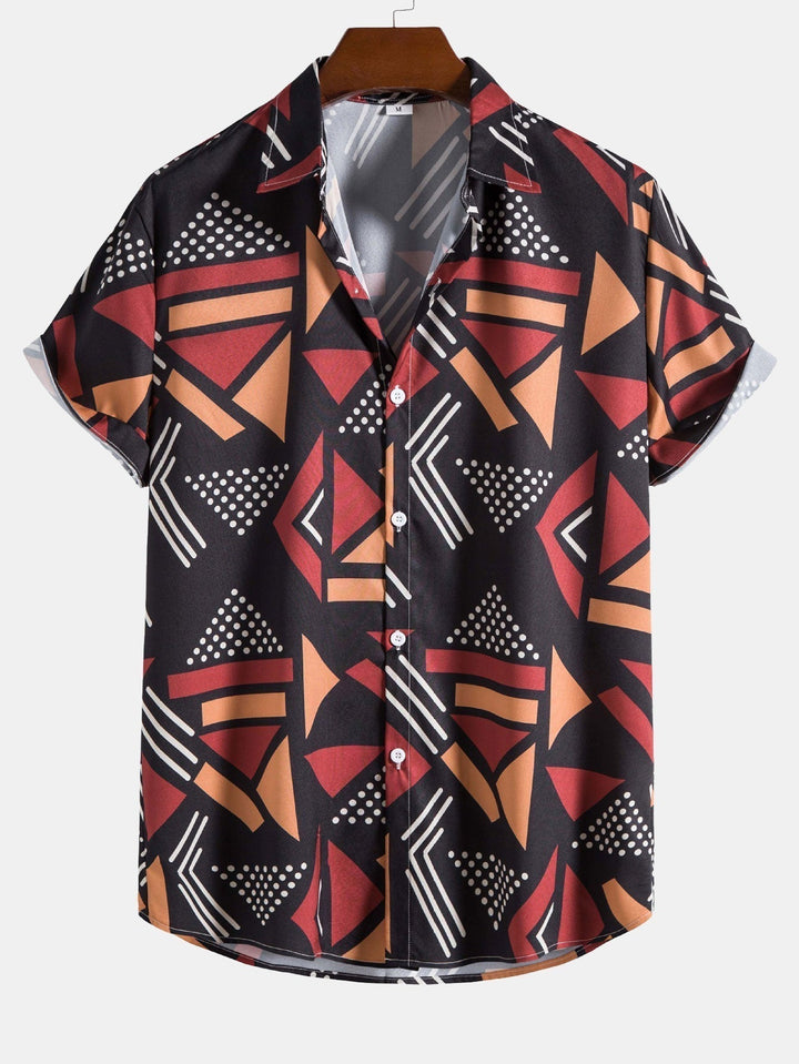 Close-up view of the black and navy geometric pattern on men's swimwear set