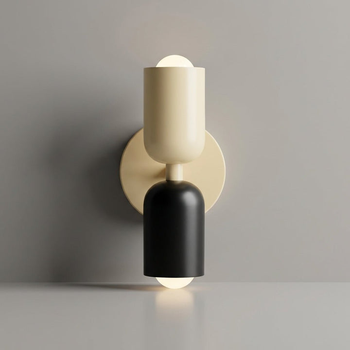 Ambient light casting warm shadows from a designer geometric wall sconce.