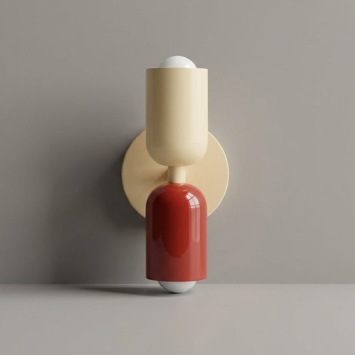 Close-up of the geometric wall sconce showing sleek lines and modern lighting design.