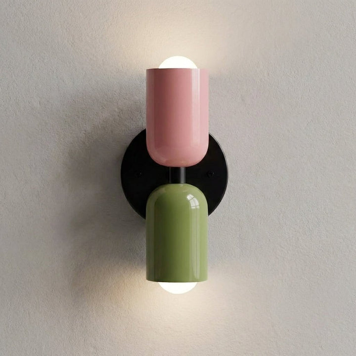 Warm ambient lighting effect created by the geometric wall sconce in a cozy bedroom.