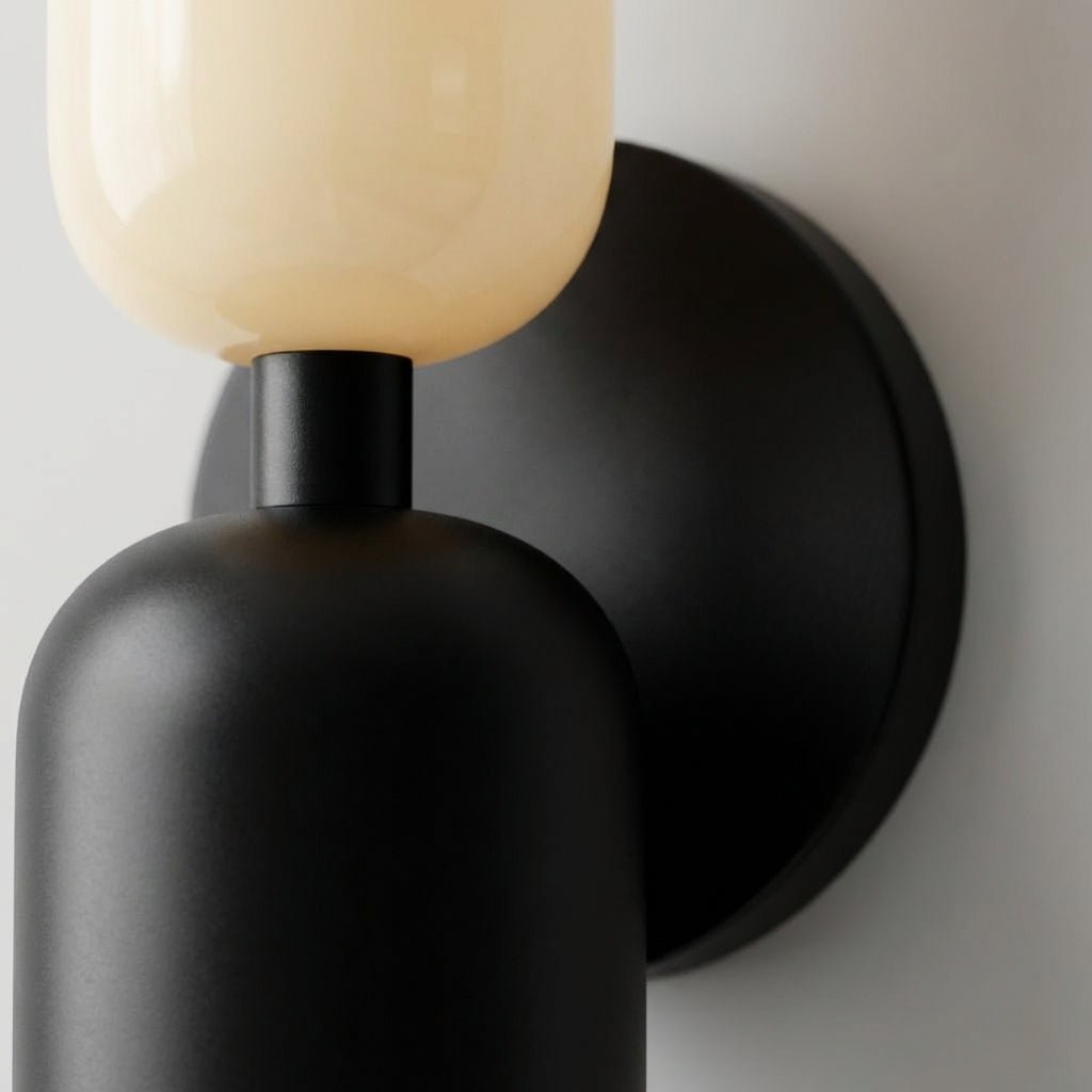 Modern geometric wall lamp glowing softly, perfect for ambient home lighting and interior decor.