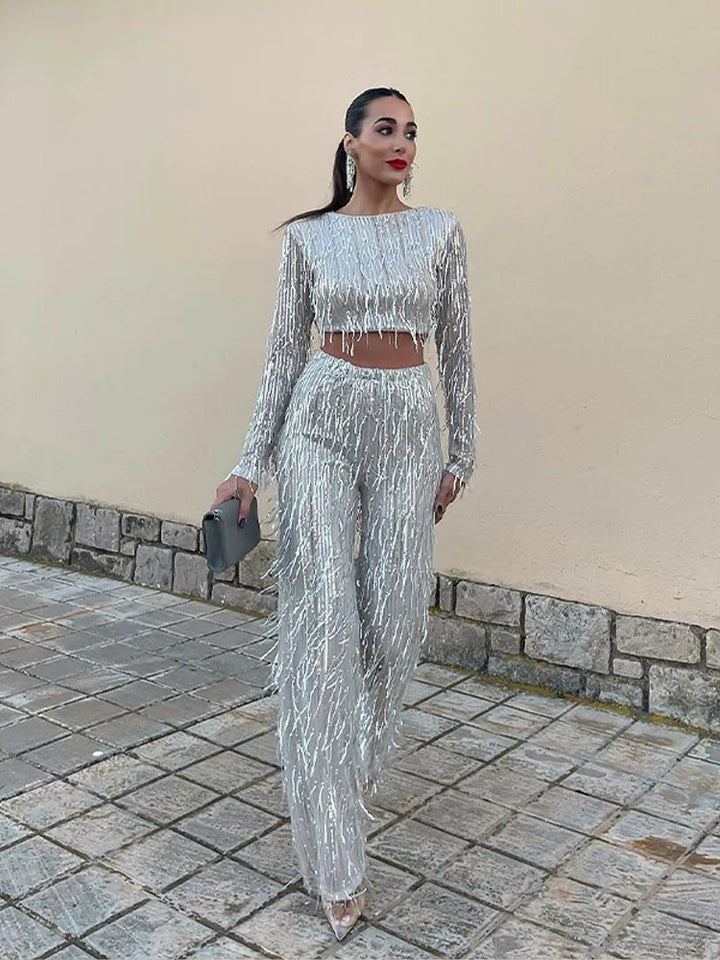 Womens black sequin two piece party outfit featuring crop top and high waist trousers