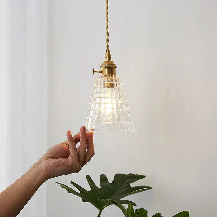 Elegant glass lighting fixture glowing softly in a cozy evening setting