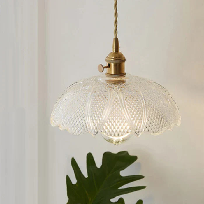 Hanging lamp suspended at adjustable height over a contemporary breakfast bar
