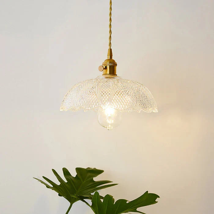 Warm glowing home lighting provided by the modern glass pendant fixture